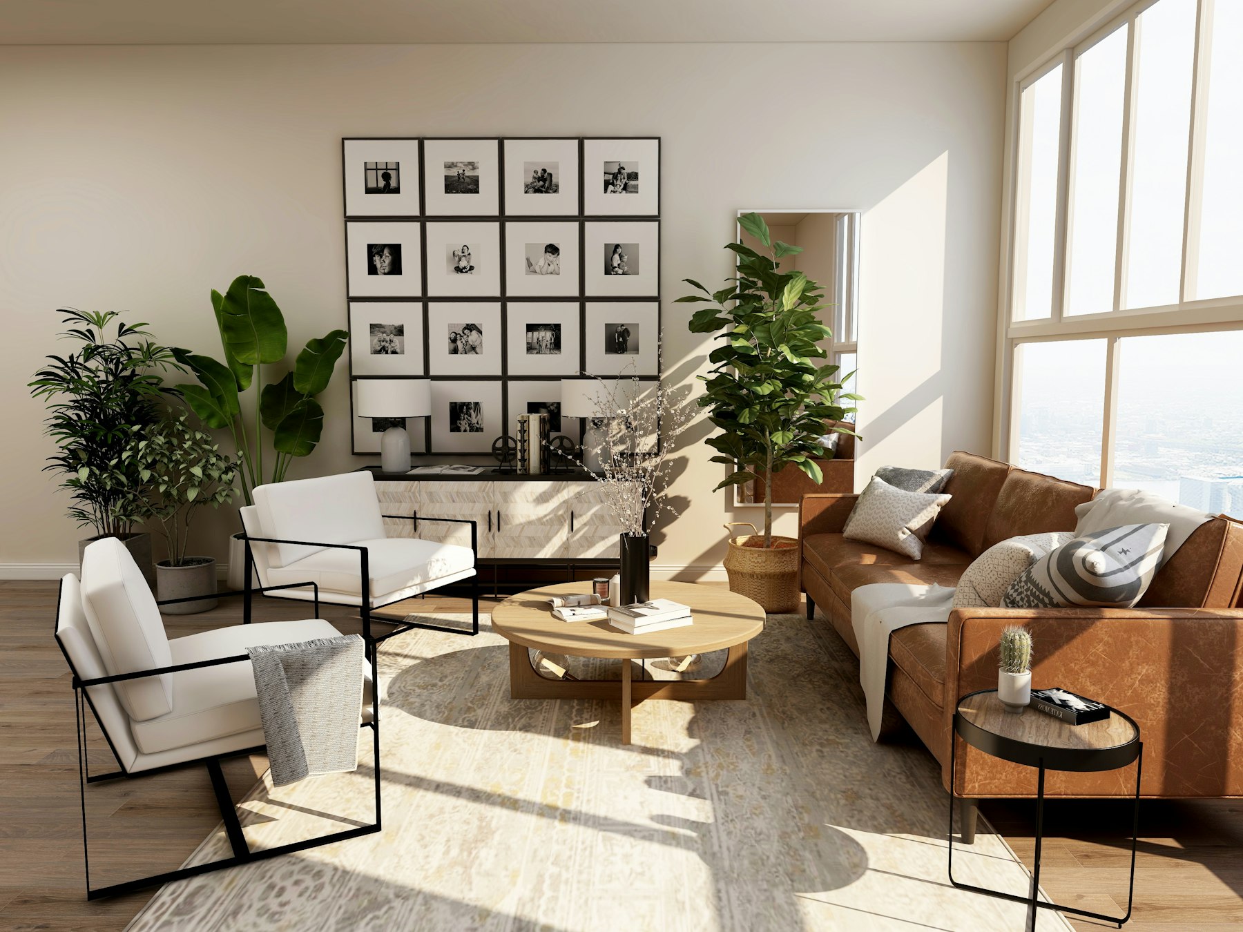 A tall, sunlit living room — leather sofa, black steel armchairs, a wall of framed photographs