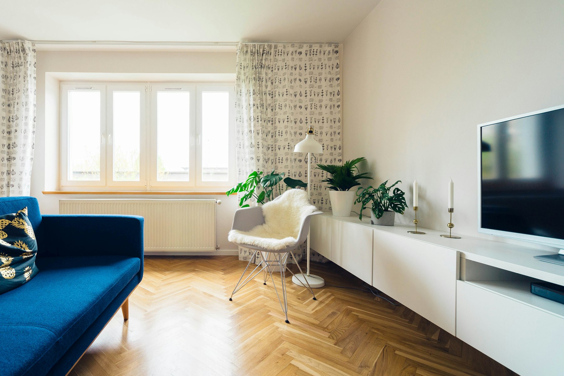A loft sitting room under warm lamplight