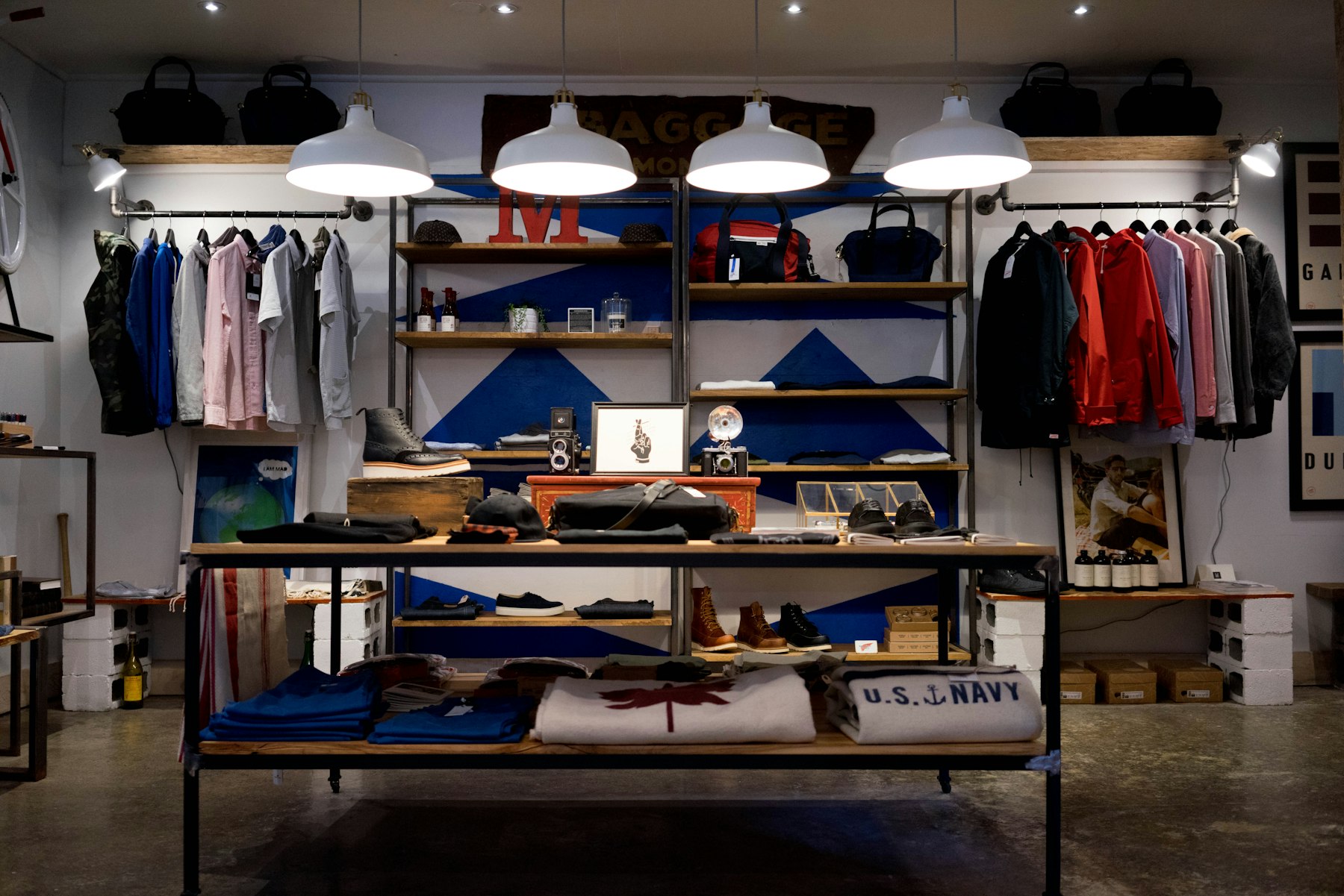 The Paris boutique interior, warm light on dark shelving