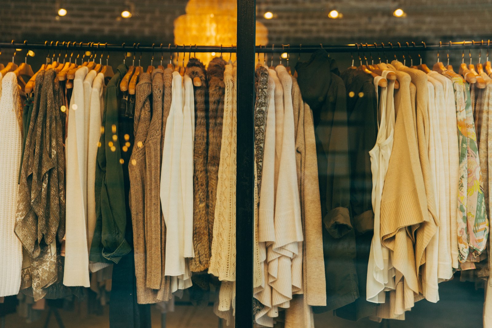 Warm-lit boutique rail in the evening