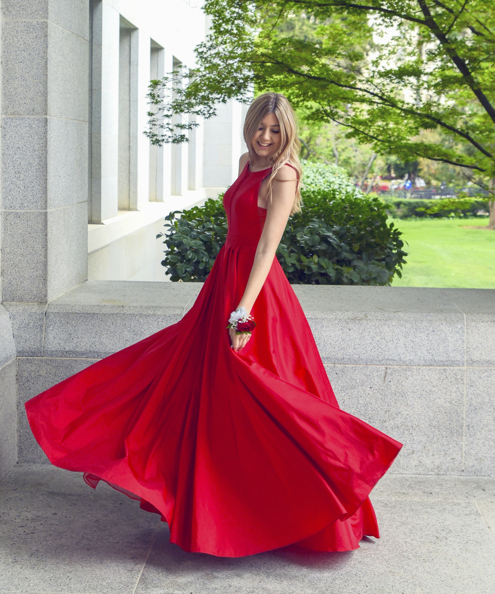 Crimson gown mid-turn, skirt in full flight