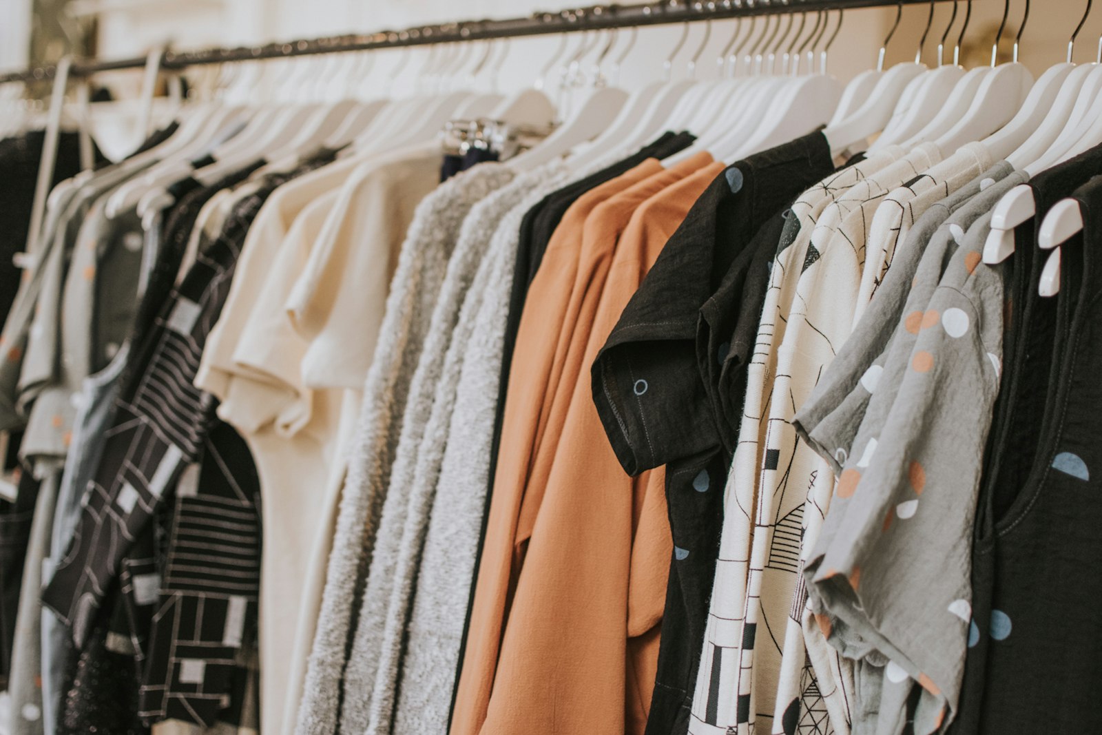 Pastel garments on a boutique rail