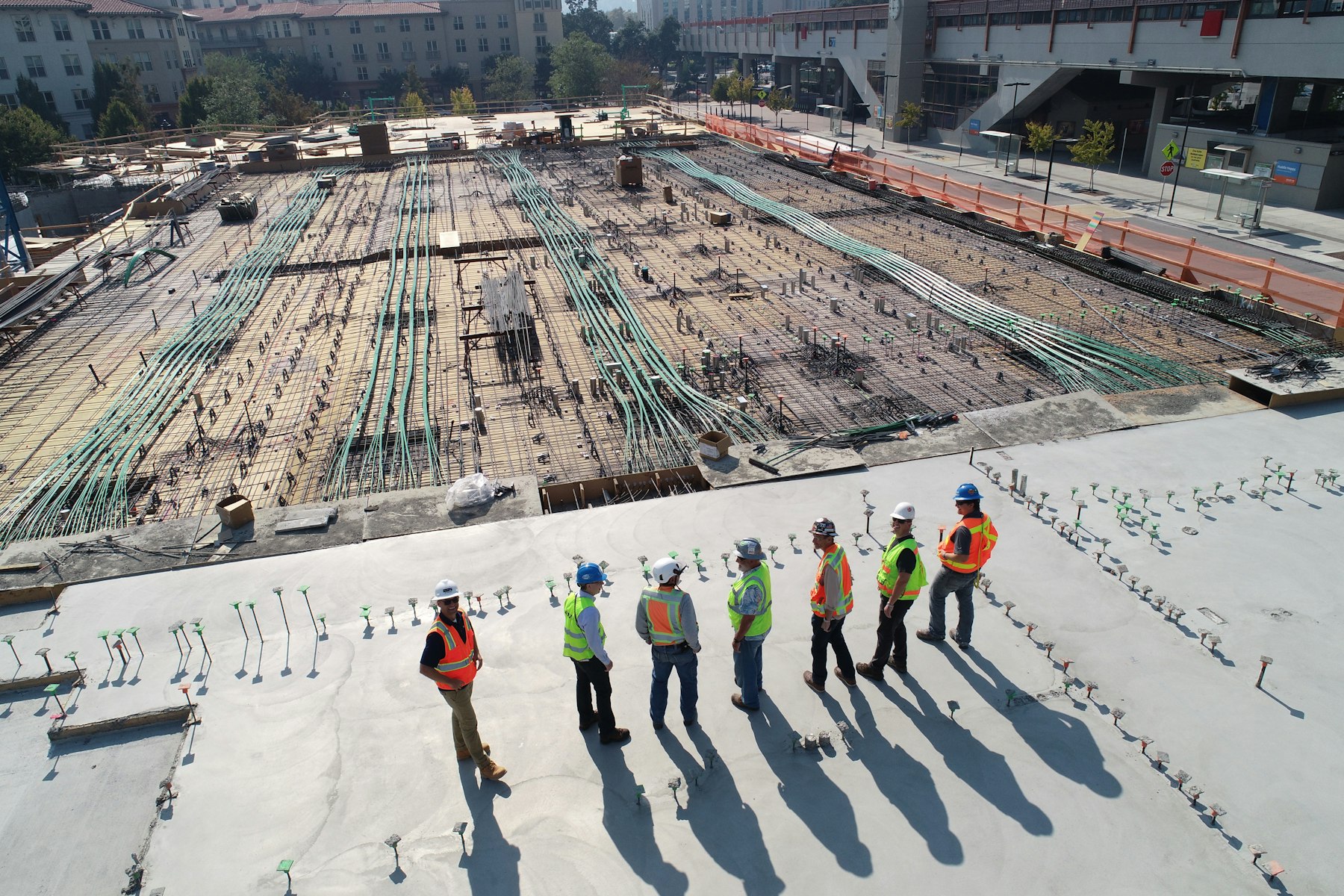 Crews on the freshly poured slab, floor 58
