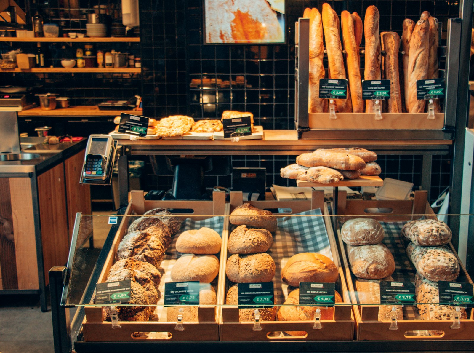 Boulangerie display case with baguettes and pastries