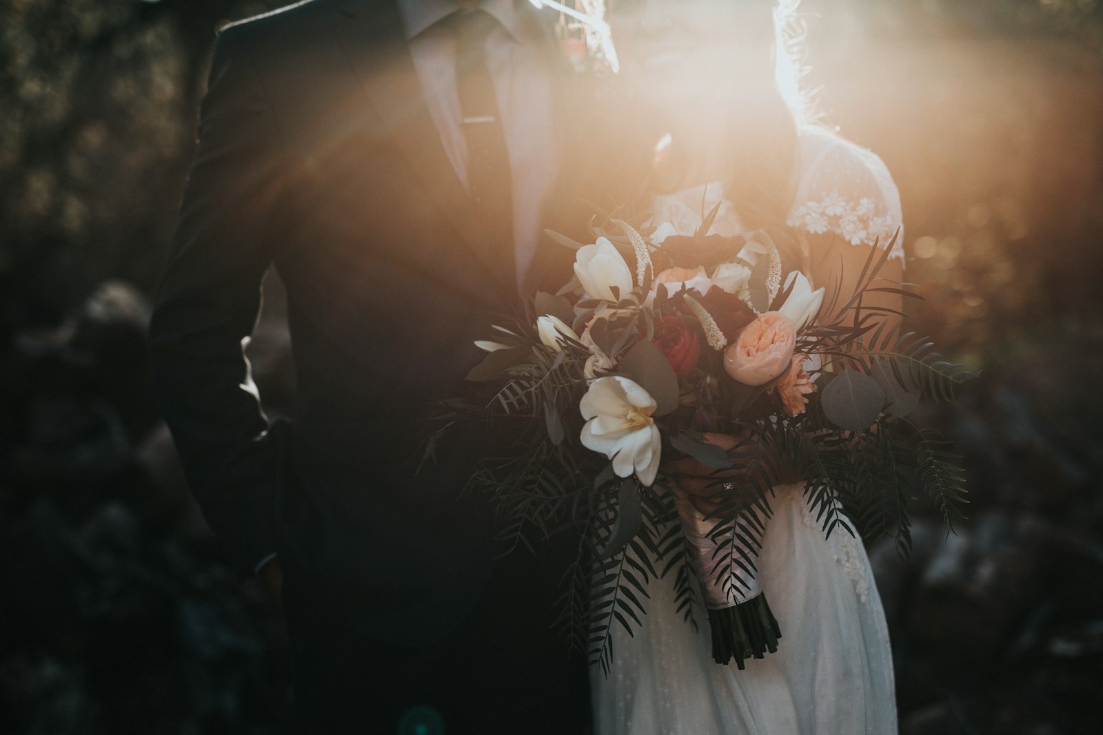 Bouquet held in golden backlight