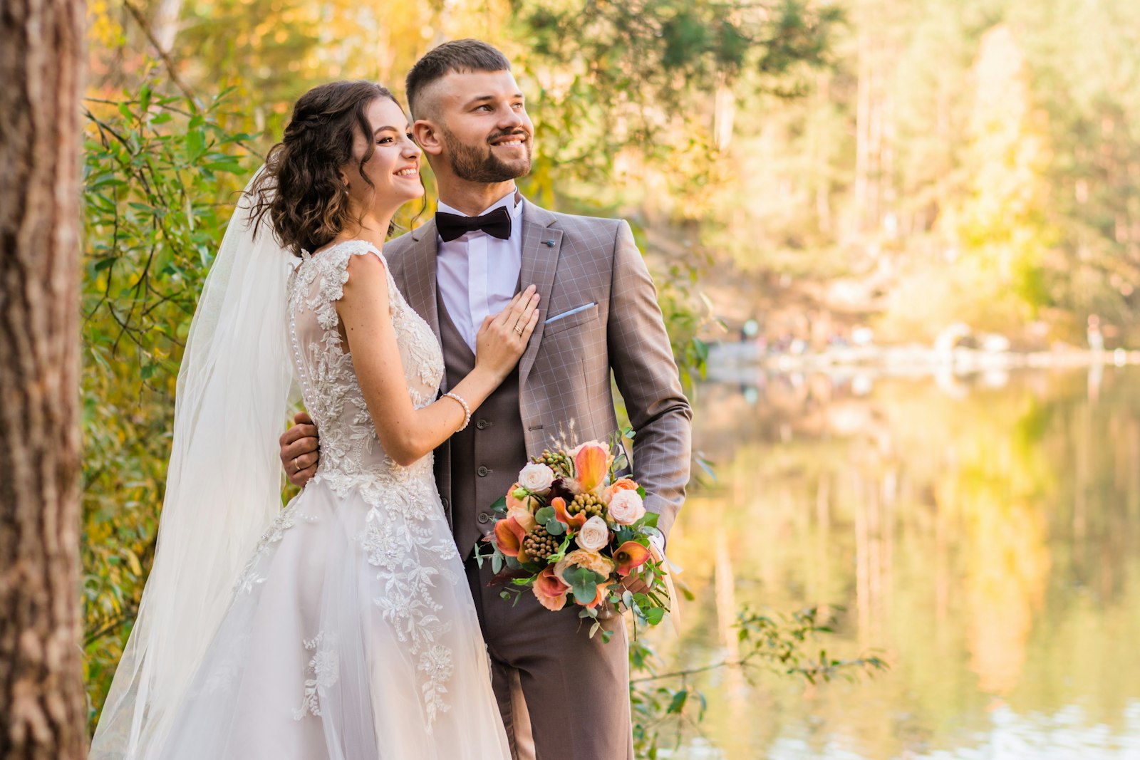 Couple by the lake in autumn
