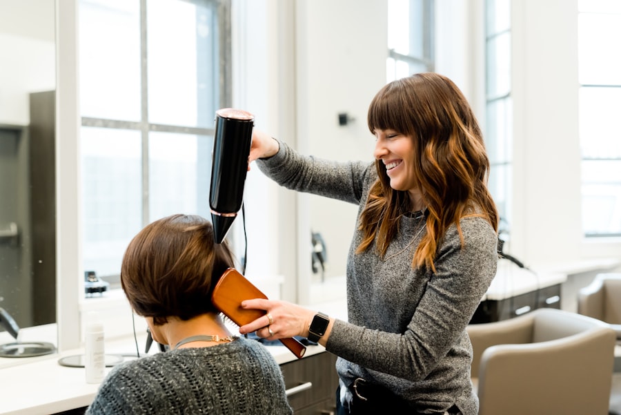 Stylist blow-drying a client