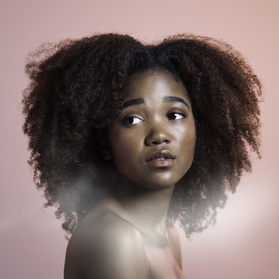 Natural curls against pink